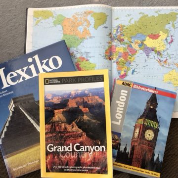 You can see a picture with different travel books on them.