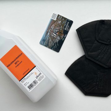picture of semester card, two masks, and a hand sanitiser