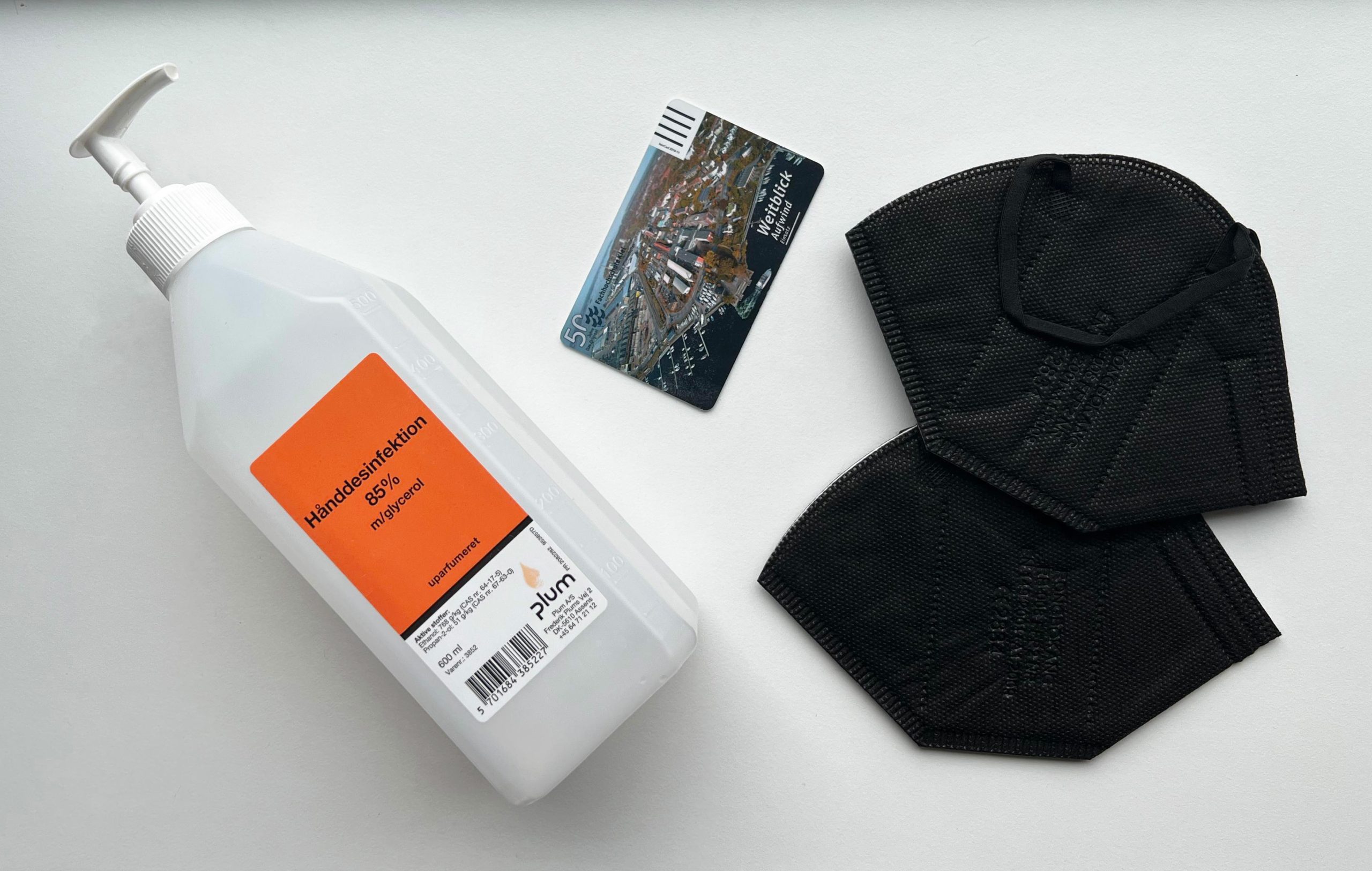 picture of semester card, two masks, and a hand sanitiser
